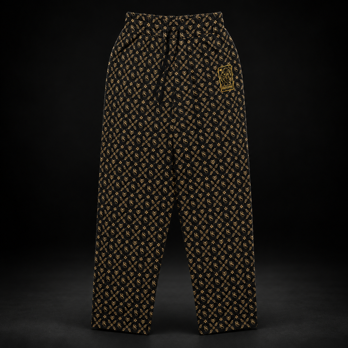 BlackStamp©™ Joggers 004, gold monogram, front product view on a dark black studio background